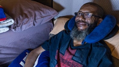 ALS patient who lost his voice uses adaptive computer technology to communicate