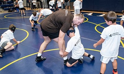 Collegiate wrestlers from across the nation came together to host a wrestling clinic Sept. 25, 2022, at Executive Education Charter Academy. Impact Athletes included Penn State’s Roman Bravo-Young, Nebraska’s Mike Labriola, Ohio State’s Sammy Sasso, Princeton’s Quincy Monday, and Lehigh’s Michael Beard and Josh Humphreys.