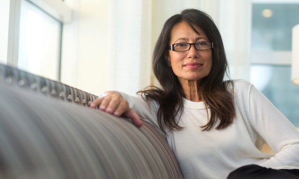 Woman sitting on sofa - LVHN